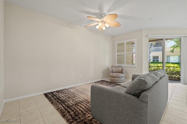 tiled living room featuring ceiling fan