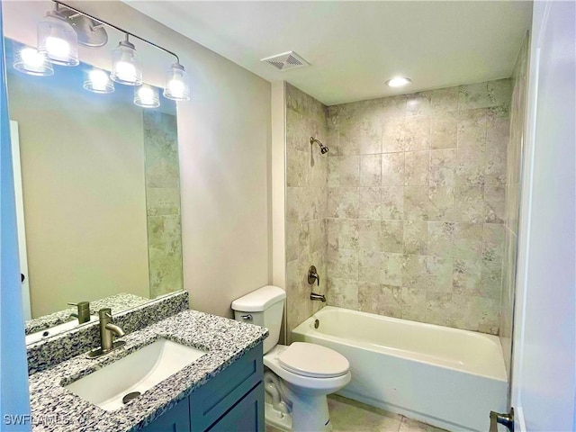 full bathroom with tile patterned floors, toilet, vanity, and tiled shower / bath