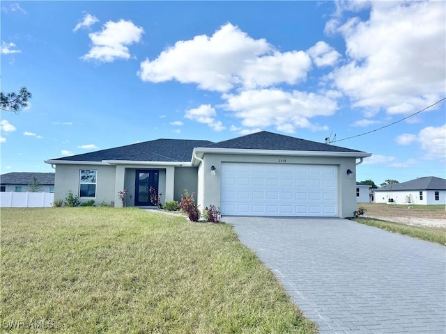 single story home with a front yard and a garage