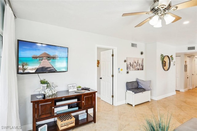 interior space with ceiling fan