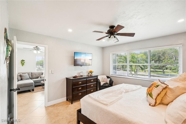 bedroom featuring light tile patterned floors and ceiling fan