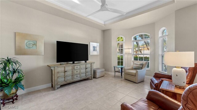 living room with ceiling fan and light tile patterned flooring