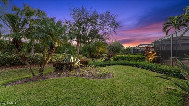 yard at dusk with glass enclosure