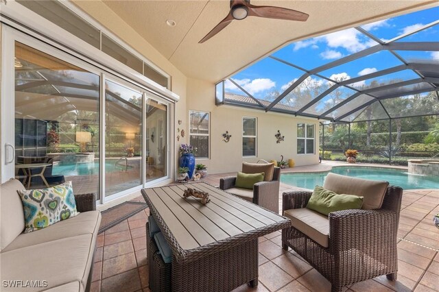 view of patio / terrace featuring pool water feature and a lanai