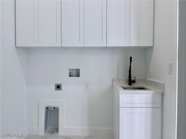 laundry room featuring electric dryer hookup, sink, cabinets, and washer hookup