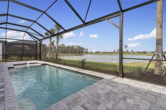 view of swimming pool featuring a patio, a water view, and glass enclosure