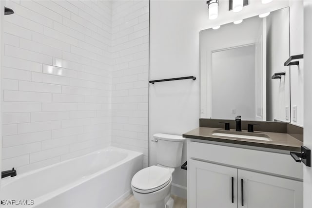 full bathroom featuring vanity, toilet, and tiled shower / bath