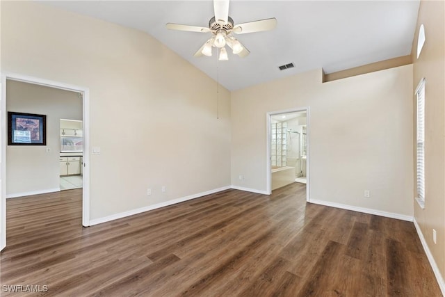 spare room with ceiling fan, dark hardwood / wood-style flooring, and lofted ceiling