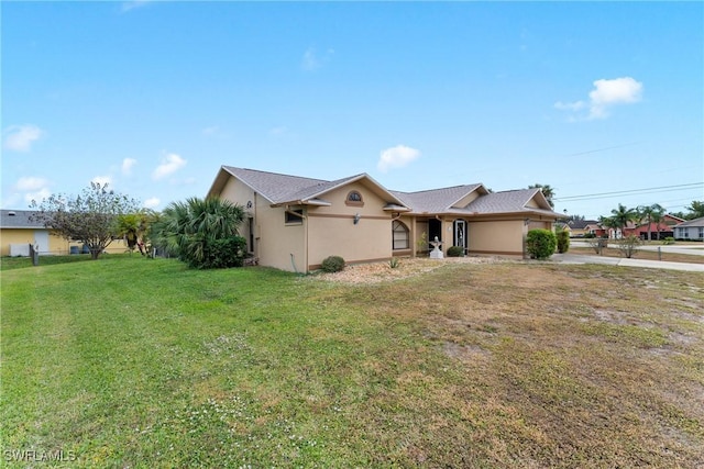 ranch-style home with a front lawn