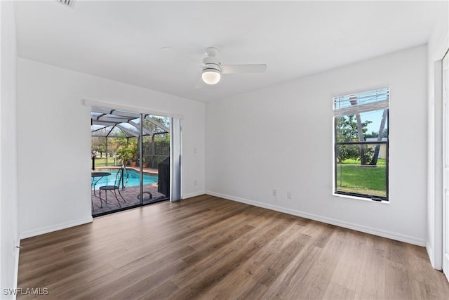 spare room featuring hardwood / wood-style flooring and ceiling fan