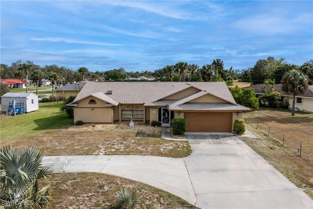 single story home with a front yard and a garage