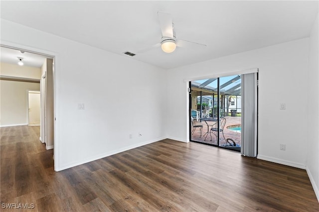 unfurnished room featuring ceiling fan and dark hardwood / wood-style floors