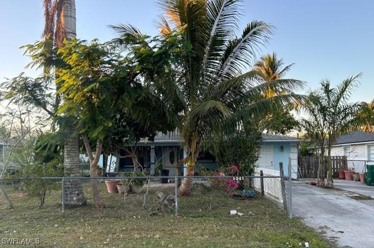 view of property hidden behind natural elements