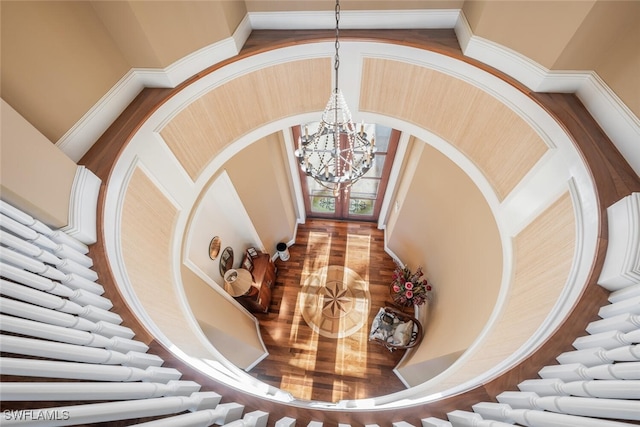 staircase featuring a chandelier