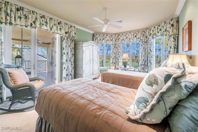 bedroom featuring access to outside, multiple windows, ceiling fan, and ornamental molding