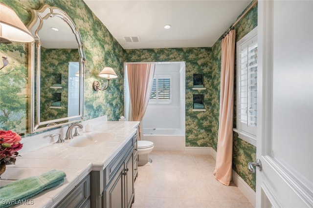 full bathroom with tile patterned floors, shower / bath combo, toilet, and vanity