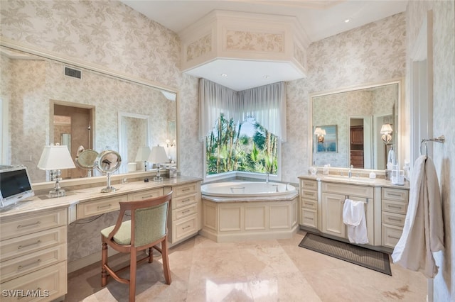 bathroom with tile patterned flooring, vanity, and a tub