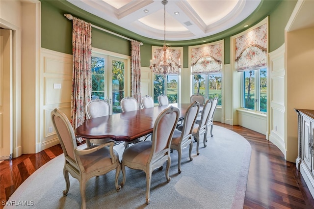 dining room with french doors, a high ceiling, coffered ceiling, dark hardwood / wood-style floors, and a chandelier