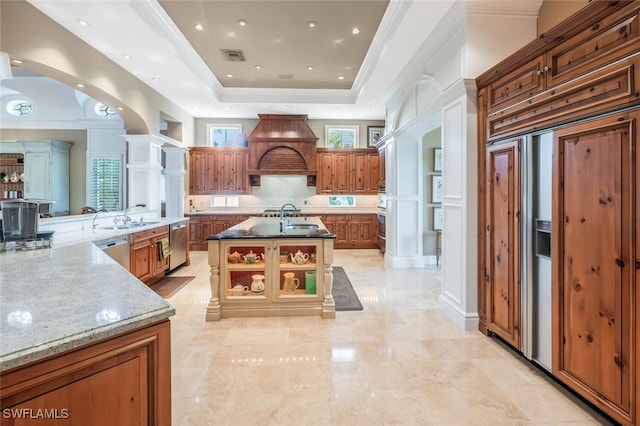 kitchen with a large island, dishwasher, premium range hood, and dark stone counters