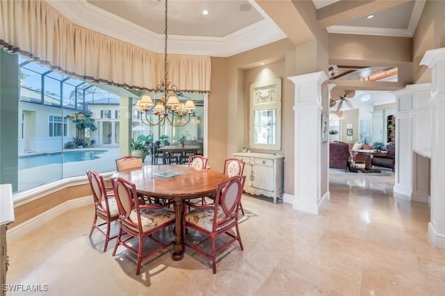 dining space featuring a notable chandelier, ornate columns, ornamental molding, and a high ceiling