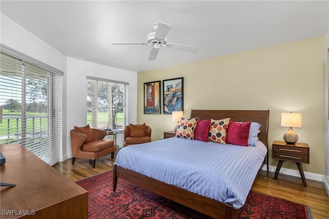 bedroom featuring ceiling fan and dark hardwood / wood-style flooring