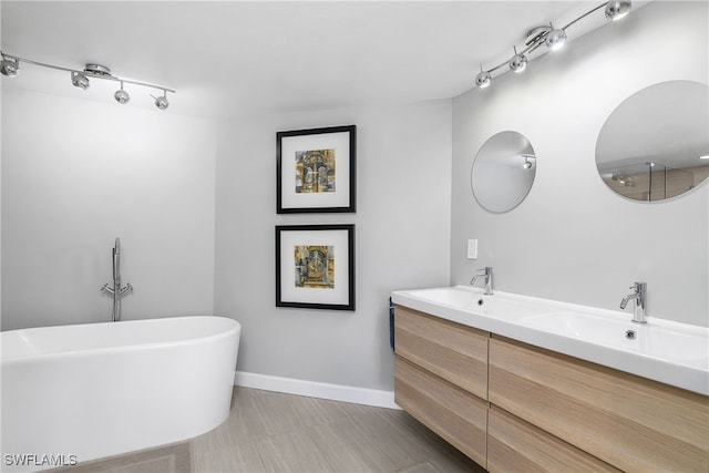 bathroom featuring vanity and a bathing tub