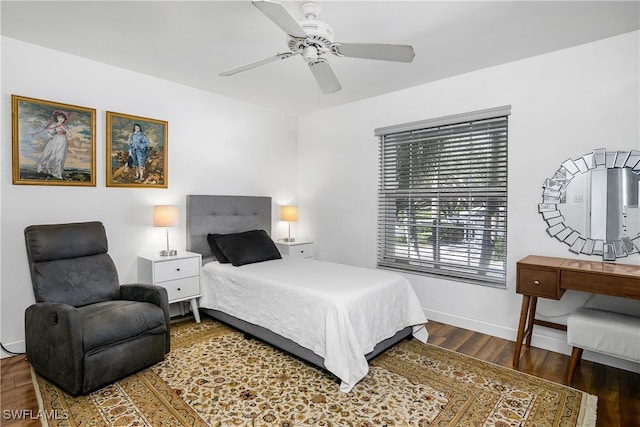 bedroom with ceiling fan and dark hardwood / wood-style floors