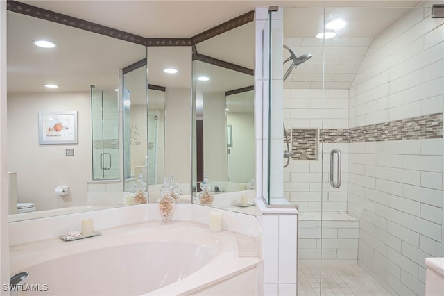 bathroom with shower with separate bathtub and toilet