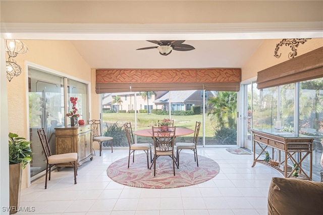 sunroom / solarium featuring vaulted ceiling and a wealth of natural light