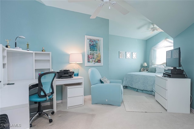 carpeted bedroom featuring ceiling fan and vaulted ceiling