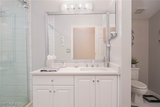 bathroom with walk in shower, a notable chandelier, tile patterned floors, toilet, and vanity