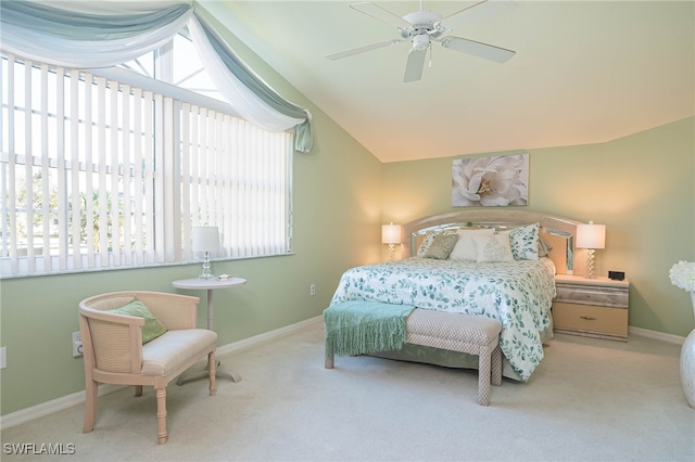 bedroom featuring light carpet, ceiling fan, and lofted ceiling