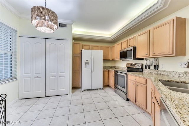 kitchen featuring appliances with stainless steel finishes, crown molding, light brown cabinets, decorative light fixtures, and a notable chandelier