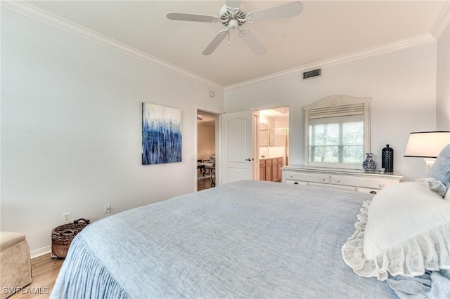 bedroom featuring ceiling fan, crown molding, ensuite bathroom, and hardwood / wood-style flooring