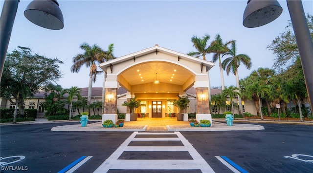 view of outdoor building at dusk