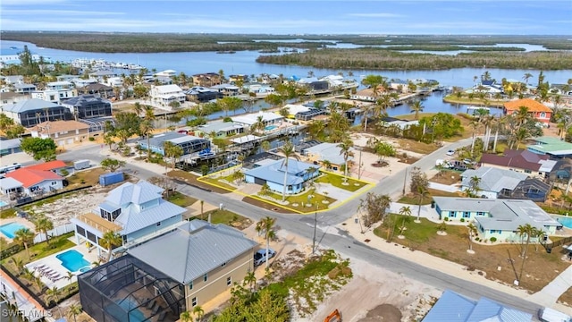 birds eye view of property featuring a water view