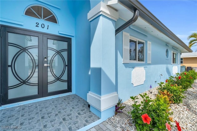 property entrance featuring french doors