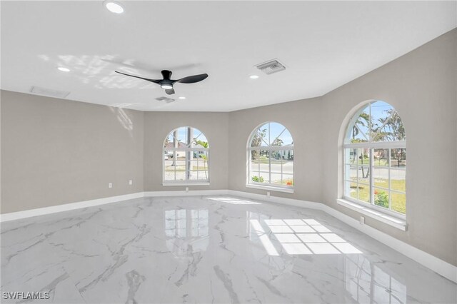 empty room featuring ceiling fan