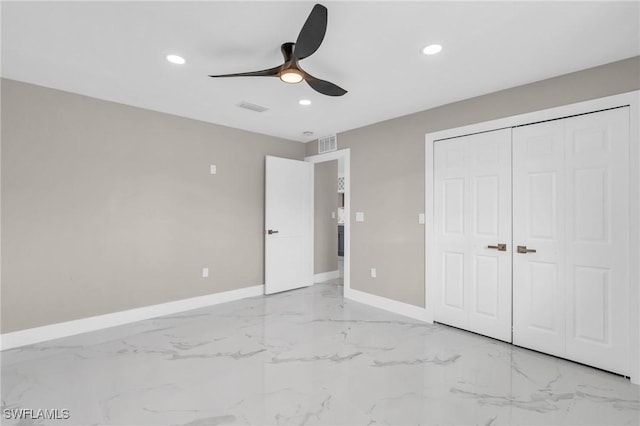 unfurnished bedroom with ceiling fan and a closet