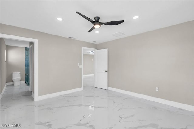 unfurnished bedroom featuring ensuite bathroom and ceiling fan