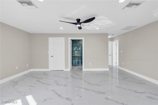 spare room with ceiling fan