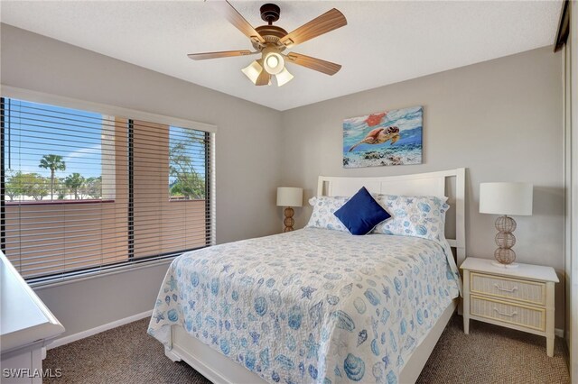 bedroom with carpet, baseboards, and a ceiling fan