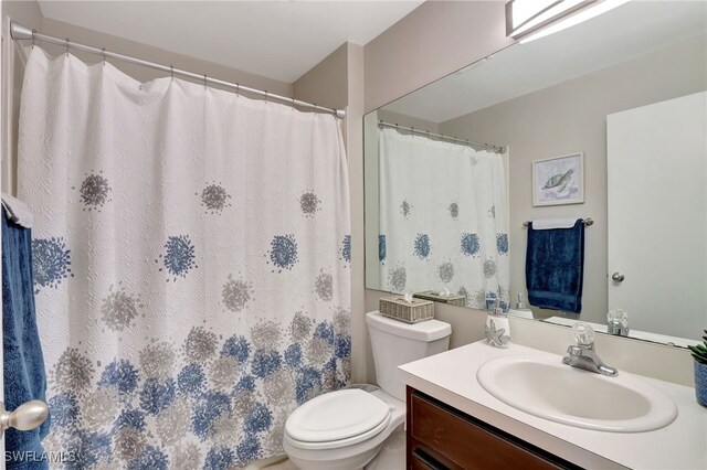 bathroom featuring toilet and vanity