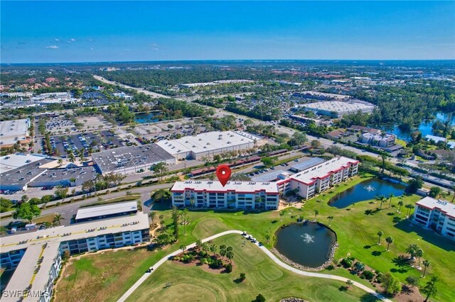 aerial view featuring a water view and view of golf course