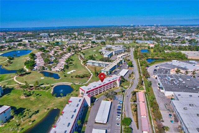 bird's eye view with golf course view and a water view