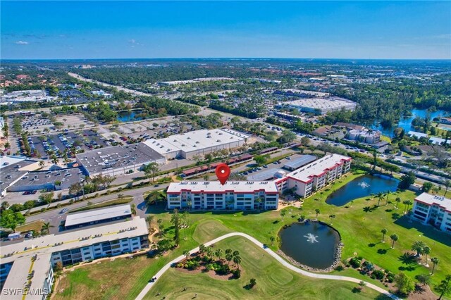 aerial view featuring a water view and golf course view