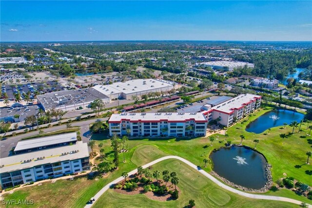 bird's eye view with a water view and view of golf course