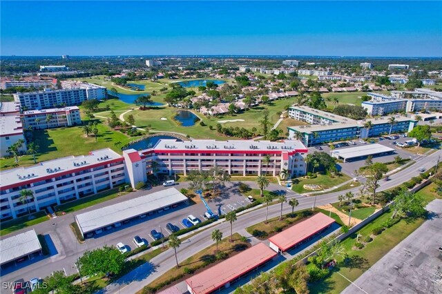 drone / aerial view with a view of city and a water view