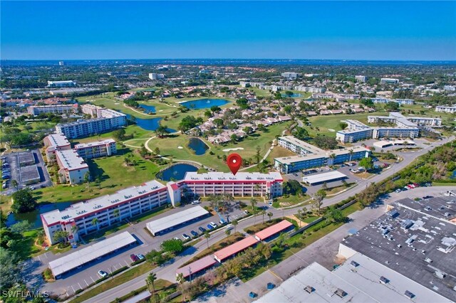 bird's eye view featuring a water view and a view of city