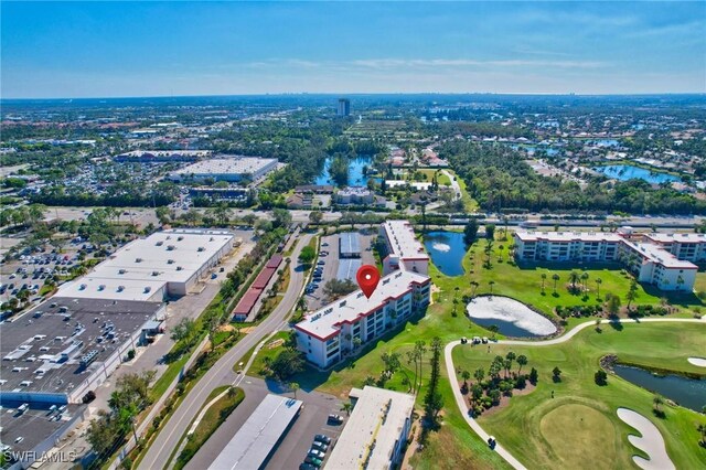 bird's eye view with a water view and golf course view